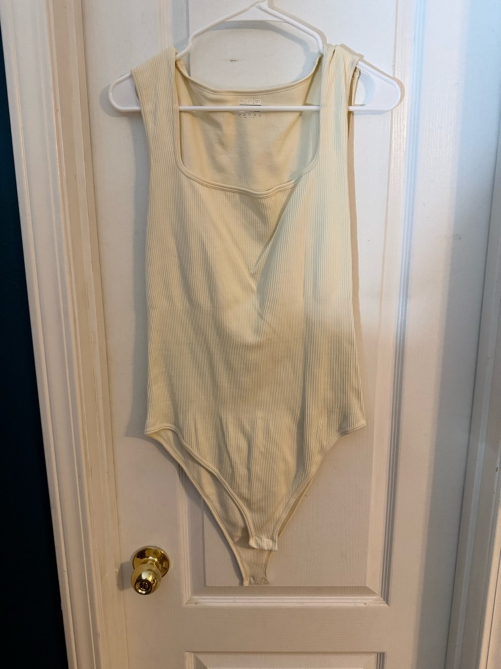 Sleeveless Ribbed Bodysuit in Cream
